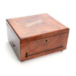 A LATE 19TH CENTURY SYMPHONION MUSIC BOX the walnut case with inlaid lid opening to reveal a 10"