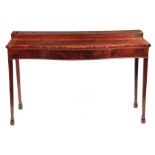 A LATE GEORGIAN SERPENTINE FRONTED FIGURED MAHOGANY SERVING TABLE having a built-up superstructure