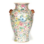 A 19TH CENTURY MILLEFIORI PORCELAIN CHINESE VASE decorated with colourful flowerheads - signed six-