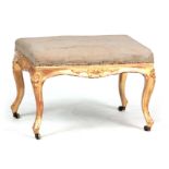 A 19TH CENTURY CARVED GILTWOOD HEPPLEWHITE STYLE STOOL with floral carved decoration having an