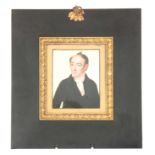 A 19TH CENTURY MINIATURE ON IVORY Portrait of a gentleman, mounted in a gilt bronze frame with