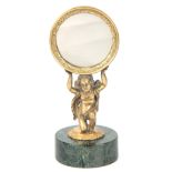 AN EARLY 20TH CENTURY GILT BRONZE DRESSING TABLE MIRROR with engraved circular frame supported by