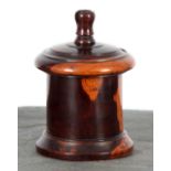 A 19TH CENTURY PATINATED LIGNUM VITAE STRING BOX of turned cylindrical form with incised lid and