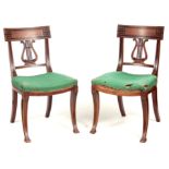 A PAIR OF REGENCY MAHOGANY LYRE SHAPED BACK SPLAT SIDE CHAIRS with dished upholstered seats raised