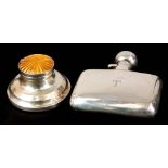 AN EARLY 20TH CENTURY SILVER HIP FLASK of plain bowed cushion form with twist off fastening hinged