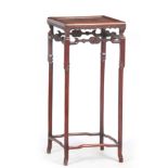 A 19TH CENTURY CHINESE HARDWOOD JARDINIERE STAND the square moulded top above an open carved base