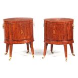 A PAIR OF SATINWOOD SHERATON STYLE OVAL CELLARETTES with inlaid cross-banded hinged tops; raised