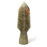 A CHINESE CARVED RUSSET JADE ARROWHEAD with scrolled decoration 10.5cm