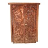 A SET OF EARLY 20TH CENTURY INDIAN CARVED HARDWOOD DOORS elaborately carved with figures and