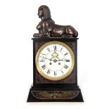 A STYLISH 19TH CENTURY EGYPTESQUE BLACK SLATE MANTEL CLOCK with bronze Sphinx surmount and decorated