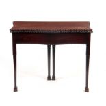 A GEORGE III CHIPPENDALE STYLE SERPENTINE MAHOGANY TEA TABLE with egg and dart moulded border; on