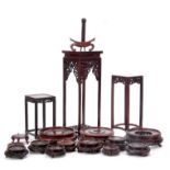A COLLECTION OF 17 CHINESE HARDWOOD VASE STANDS AND PLANT STANDS of various sizes (17)