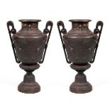 AN INTERESTING PAIR OF AESTHETIC PERIOD ART NOUVEAU STYLE CAST IRON URNS - POSSIBLY COALBROOKDALE