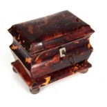 A 19TH CENTURY TORTOISESHELL TEA CADDY with a moulded body and hinged top revealing an inner lid;