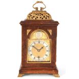 A 20TH CENTURY WILLIAM AND MARY STYLE BURR WALNUT BASKET TOP MANTEL CLOCK with a 3.75" brass