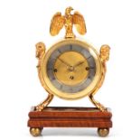 AN EARLY 19TH CENTURY AUSTRIAN GRAND SONNERIE MANTEL CLOCK the gilt drum-shaped case surmounted by