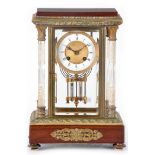 A LATE 19TH CENTURY FRENCH BRASS AND MAHOGANY FOUR-GLASS MANTEL CLOCK the glass-panelled brass