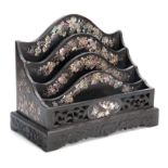 A LATE 19THCENTURY ORIENTAL EBONIZED AND MOTHER OF PEARL INLAID LETTER RACK of four divisional
