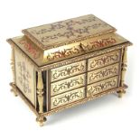 A 19TH CENTURY FRENCH CONTRA BOULLE AND TORTOISESHELL TABLE-TOP JEWELLERY CASKET with concave