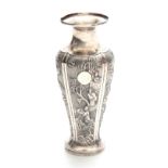 A CHINESE SILVER VASE decorated with relief work panels depicting blossoming trees, songbirds and