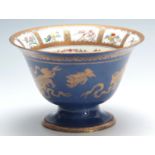 A WEDGWOOD ENGLAND LARGE FLARED PEDESTAL BOWL the centre with Oriental tightly scrolled flower and