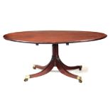 A LARGE GEORGE III MAHOGANY OVAL TOP PEDESTAL DINING TABLE having a crossbanded moulded edge above a