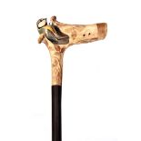 AN UNUSUAL EARLY 20th CENTURY CARVED STAGHORN HANDLED WALKING CANE the antler carved out at the root