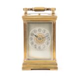 A LATE 19TH CENTURY FRENCH REPEATING CARRIAGE CLOCK the moulded brass case enclosing a silvered dial