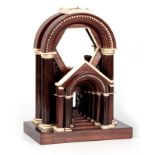 A 19TH CENTURY CONTINENTAL MAHOGANY AND IVORY GRAND TOUR SCULPTURE with an arched top supported by