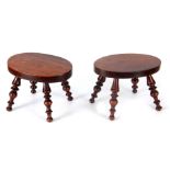 A PAIR OF 19TH CENTURY SOLID ROSEWOOD STOOLS with oval tops and bulbous turned leg supports 28cm