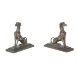 A PAIR OF 19TH CENTURY PATINATED BRONZE SCULPTURES modelled as heraldic greyhounds sitting on