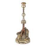 AN EARLY 20TH CENTURY TAXIDERMY PETER SPICER CANDLESTICK nickel-plated brass and mounted on an
