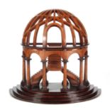 A 20th CENTURY CONTINENTAL WALNUT ARCHED-TOP GRAND TOUR MODEL having sweeping stairs and column