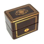A 19TH CENTURY BRASS INLAID MAHOGANY DECANTER BOX with inlaid floral decoration to the top revealing