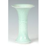 A 19TH CENTURY CELADON VASE with raised leaf work decoration and flared neck - signed underneath
