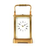A LATE 19TH CENTURY FRENCH REPEATING CARRIAGE CLOCK the corniche style case enclosing a porcelain