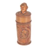 A 19TH CENTURY CONTINENTAL CARVED FRUITWOOD CANISTER with mask head top and figurehead panel to