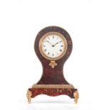 A LATE 19TH CENTURY ORMOLU MOUNTED TORTOISESHELL VENEERED BALLOON SHAPED MANTEL CLOCK the 3.5"