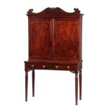 A REGENCY FIGURED MAHOGANY AND EBONY STRUNG SECRETAIRE CABINET IN THE MANNER OF GEORGE BULLOCK -