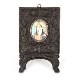 A 19TH CENTURY PERSIAN MINIATURE ON IVORY PORTRAIT OF A LADY mounted in a carved ebony frame 7cm