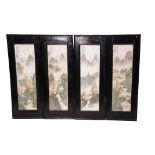 A SET OF FOUR CHINESE REPUBLIC PORCELAIN FAMILLE VERT WALL PLAQUES depicting mountainous landscapes,