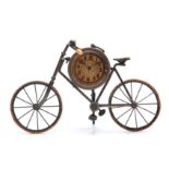 A LATE 19TH CENTURY NOVELTY BICYCLE MANTEL CLOCK modelled as a vintage 'Safety Bike' the nickel-
