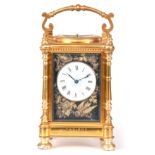 A LARGE LATE 19TH CENTURY FRENCH REPEATING CARRIAGE CLOCK IN THE JAPANESQUE TASTE the gilt brass