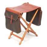 A MULBERRY DOUBLE SATCHEL X FRAME FOLDING STOOL with leather seat. 49cm width 36cm deep 54cm high.