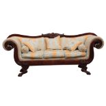 AN IMPRESSIVE LARGE REGENCY IRISH MAHOGANY SETTEE with scrolled ends and shaped leaf carved supports