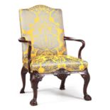 A GOOD GEORGE II WALNUT OPEN ARMCHAIR OF GENEROUS SIZE having an upholstered back and seat with