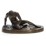A 19TH CENTURY GRAND TOUR FIGURAL BRONZE depicting a wounded gladiator, mounted on an oval base 29cm