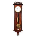 A 19TH CENTURY BIEDERMIER VIENNA REGULATOR WALL CLOCK the rosewood case with carved pediment above a