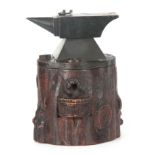 AN UNUSUAL 19TH CENTURY BLACK FOREST TYPE HUMIDOR MODELLED AS A FORGE the realistic notched carved