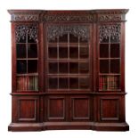 AN IMPRESSIVE 19TH CENTURY LOW WAISTED MAHOGANY INVERTED BREAKFRONT BOOKCASE IN THE MANNER OF
